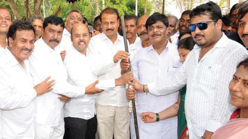 PWD Minister Dr H.C. Mahadevappa with son Sunil Bose and the CMs son Dr Yathindra Siddaramaiah in a file photograph