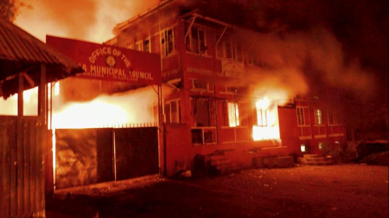 Naga tribals set ablaze the Kohima Municipal Council office and the office of the district collector to protest against Chief Minister TR Zeliangs refusal to meet their ultimatum, in Kohima. (Photo: PTI)