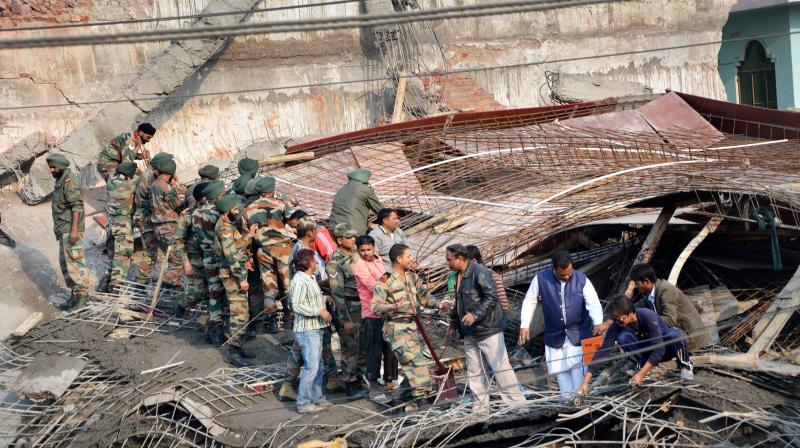Army jawans carry out rescue and relief works after collapse of an under-construction building in Chakeri, Kanpur. (Photo: PTI)