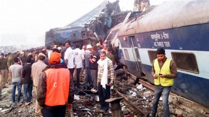 Rescue officials on the spot where 14 coaches of the Indore-Patna express derailed, killing around 90 people and injuring 150, in Kanpur Dehat on Sunday. (Photo: PTI)