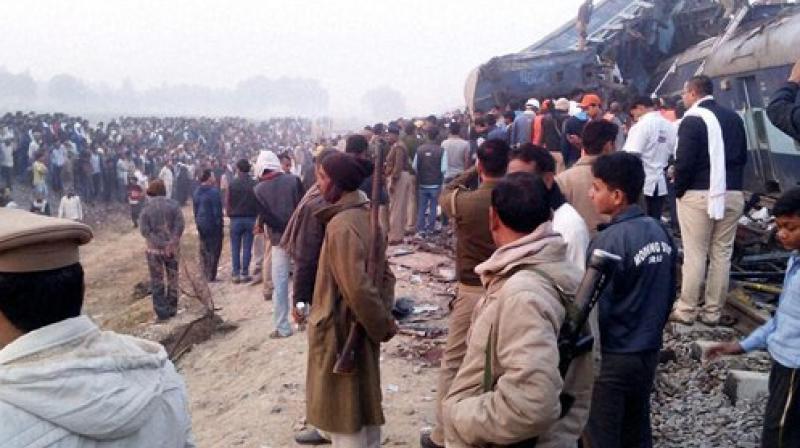 Several passengers were seen sitting shell-shocked next to the wreckage of the mangled train, including some who were rocking back and forth praying. (Photo: PTI)