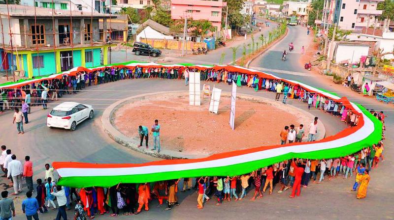 The 104-metre-long National Flag displayed in Madhira by Vibrant Kalam organisation on the occasion of National Voters Day in Khammam on Thursday. (Photo: DC)