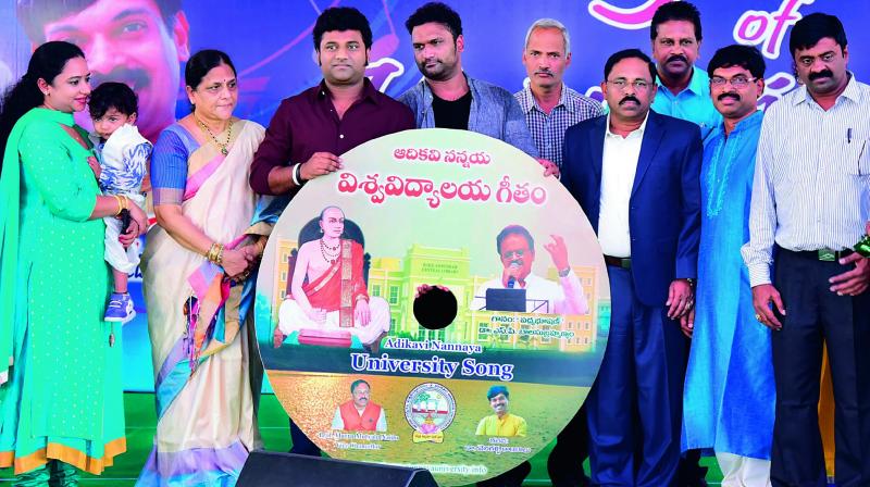 Noted Music Director Devisri Prasad releases AKNU song at the campus in Rajahmundry on Thursday. AKNU V-C M.Mutyala Naidu is also seen. (Photo: DC)