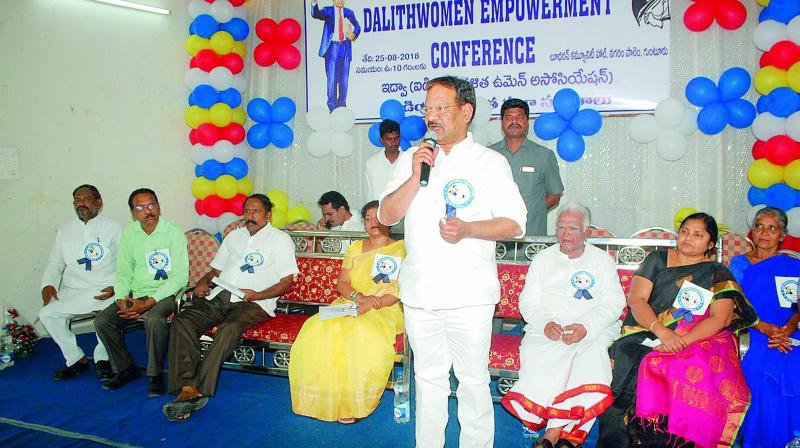 Minister Ananda Babu addressing Dalit women.