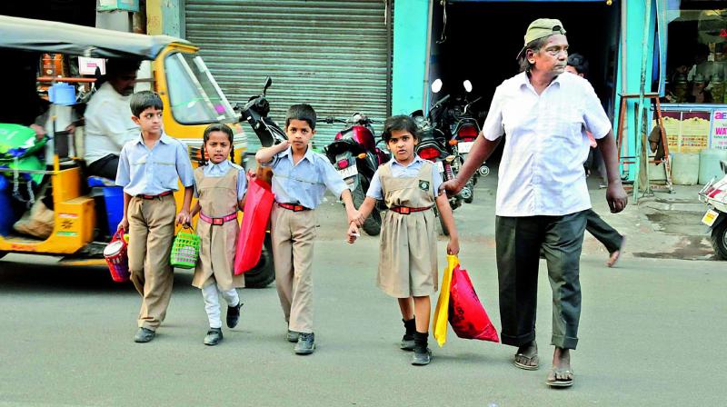 Laddu Bhai helping children cross the road