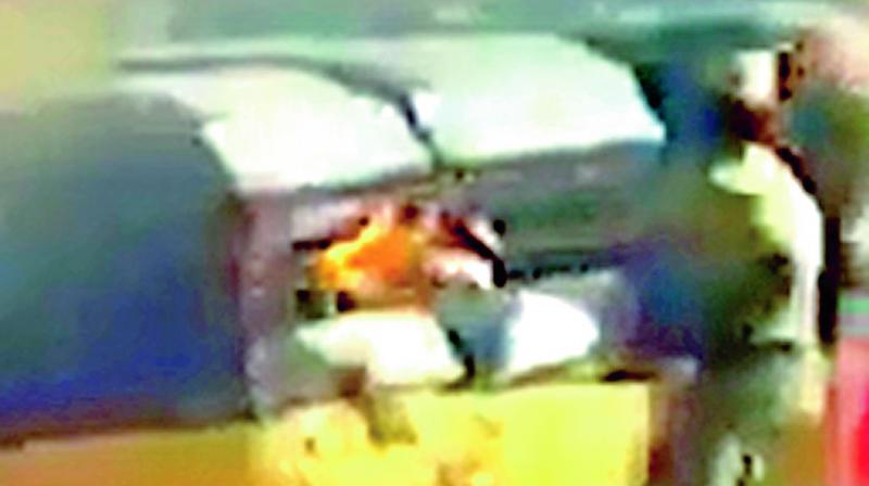 In this clip of a video that has gone viral, a policeman is seen setting an autorickshaw on fire in Mylapore.