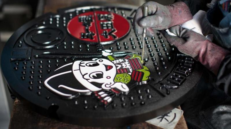 Designed manholes cost more but appeal to a Japanese sense of detail (Photo: AFP)