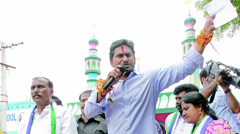 YSRC president Y.S. Jagan Mohan Reddy at a road show held in Harijanwada, Nandyal in Kurnool district on Thursday. (Photo: DC)