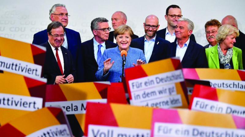 Germany election: Merkel wins 4th term but nationalists surge in vote