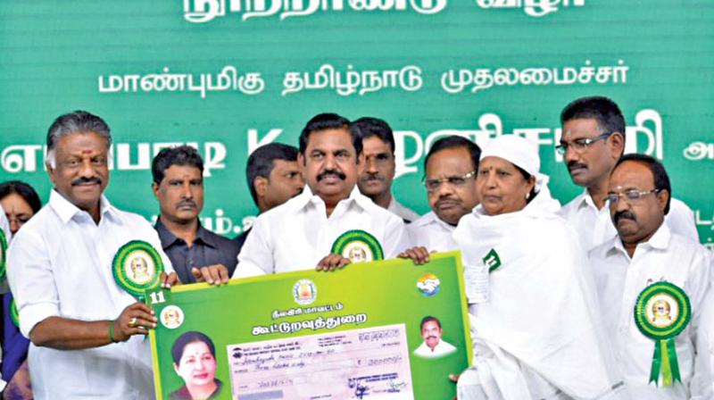 Chief Minister Edappadi K. Palaniswami distributes welfare assistance to the  beneficiaries at the MGR birth centenary celebration held at Ooty on Saturday. (Photo: DC)