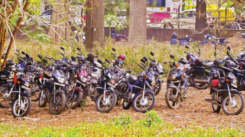 Two-wheelers parked in Cubbon Park in Bengaluru. (Photo: DC)