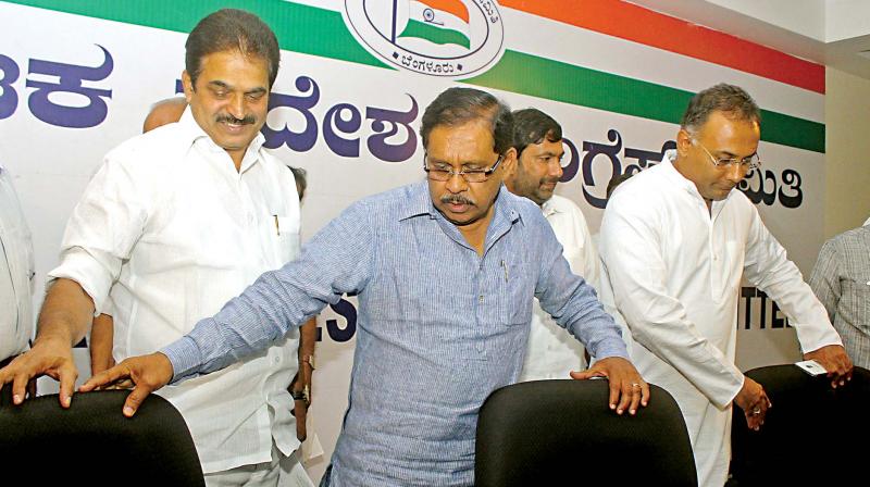 AICC General Secretary and Karnataka incharge K.C. Venugopal (from L), KPCC president Dr G. Parameshwar and party working president Dinesh Gundu Rao at a meeting in Bengaluru on Monday. (Photo: DC)