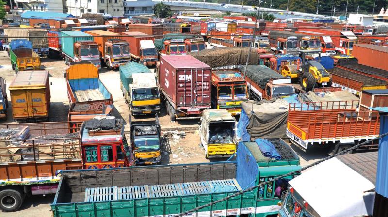 Trucks off the road following a nationwide strike by All India Confederation of Goods Vehicle Owners Associations, in Bangalore on Saturday. (Photo: DC)