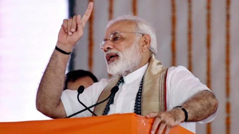 Prime Minister Narendra Modi addresses during a function for the launch of various developmental projects, in Varanasi, Uttar Pradesh on Friday. (Photo: PTI)
