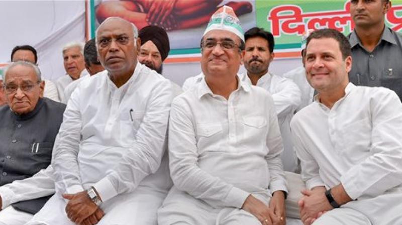 Rahul Gandhi with Congress leaders during a nationwide daylong fast against caste violence, communalism and the non-functioning of Parliament at Rajghat. (Photo: PTI)