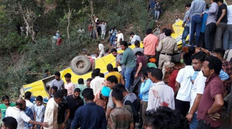According to reports, the driver lost control on a sharp curve due to which the bus slipped into the gorge and came to rest in the middle of the hillside. (Photo: ANI/Twitter)