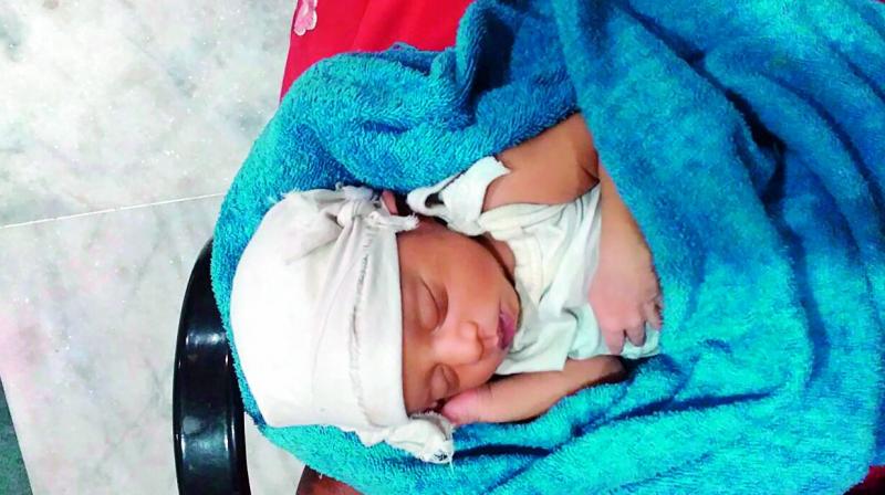 Woman named Usha, 28, gave birth to an infant child outside Gandhi Hospital, Secunderabad On Thursday. 	(Photo:DC)