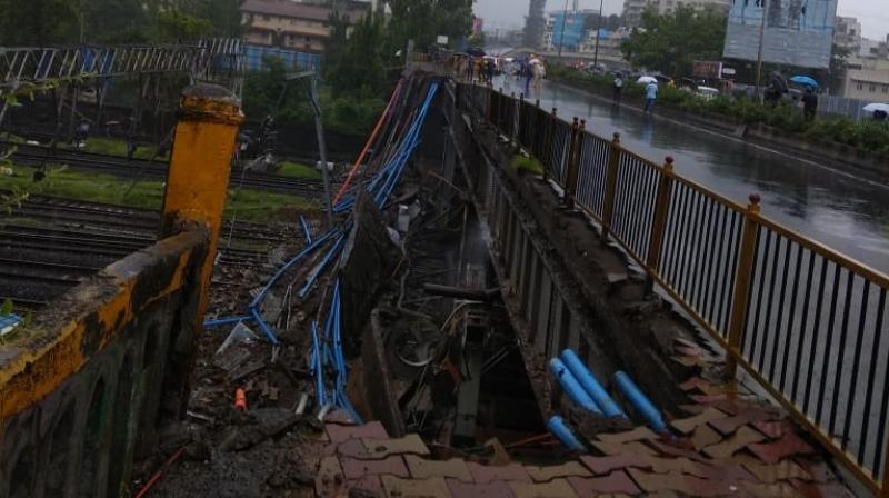 The incident has also damaged the overhead cables of the railway tracks bringing the trains movement on western line to a halt. (Photo: Twitter/@MumbaiPolice)