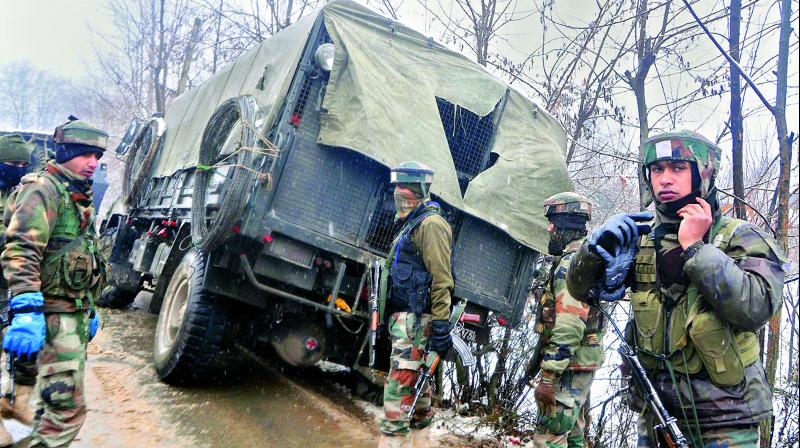 Security forces at the encounter site in Hadoora area of Shuhama in Kashmir on Tuesday. (Photo: HU NAQASH)