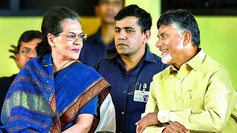 Former Congress chief Sonia Gandhi along with Andhra Pradesh Chief Minister N. Chandrababu Naidu at a public meeting after unveiling a life size bronze statue of late CM and DMK chief M. Karunanidhi at YMCA ground in Chennai, on Sunday. 	 PTI