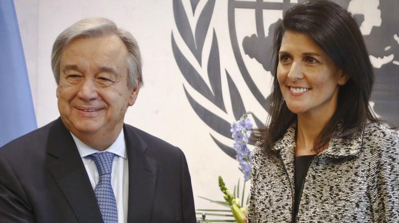 Former South Carolina Governor Nikki Haley, right, poses with United Nations Secretary General Antonio Guterres, left, after presenting him with her credentials as the new U.S. Ambassador to the United Nations, Friday. (Photo: AP)