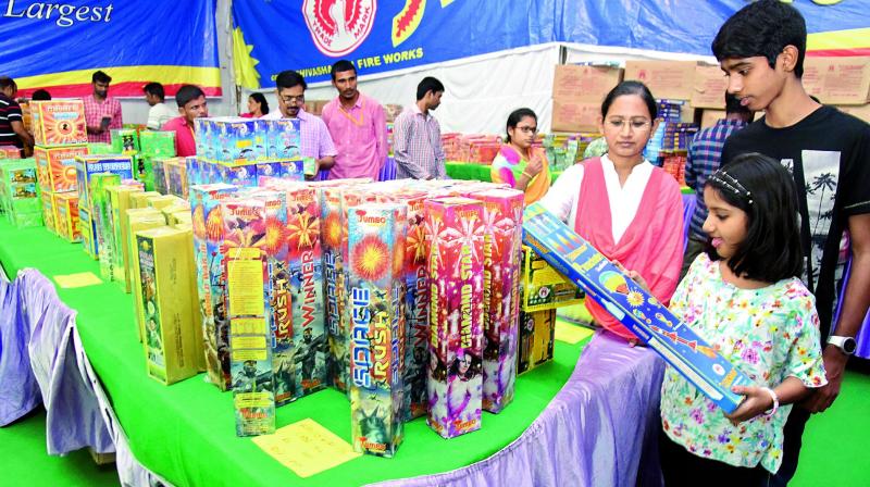 People buy crackers ahead of diwali in city on Tuesday. 	(Photo: DC)