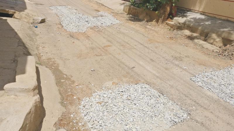 Following complaints by residents of East Division, BBMP officials filled the potholes with crushed stones and assured that asphalting will take place on Monday	  Image: DC