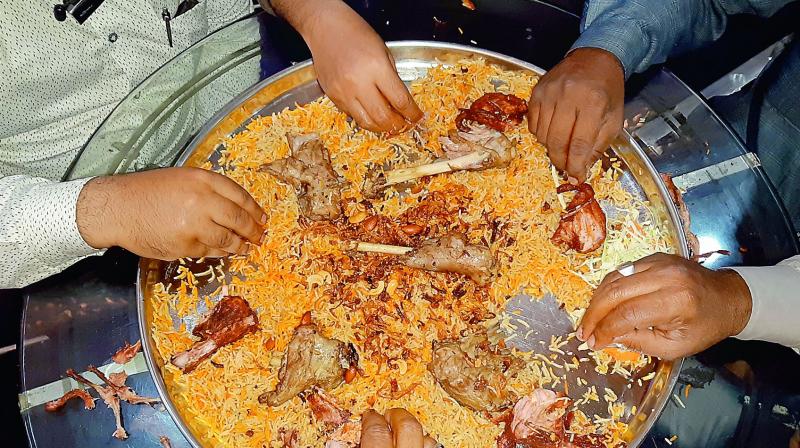 Customers relish the Arabian Mandi platter.