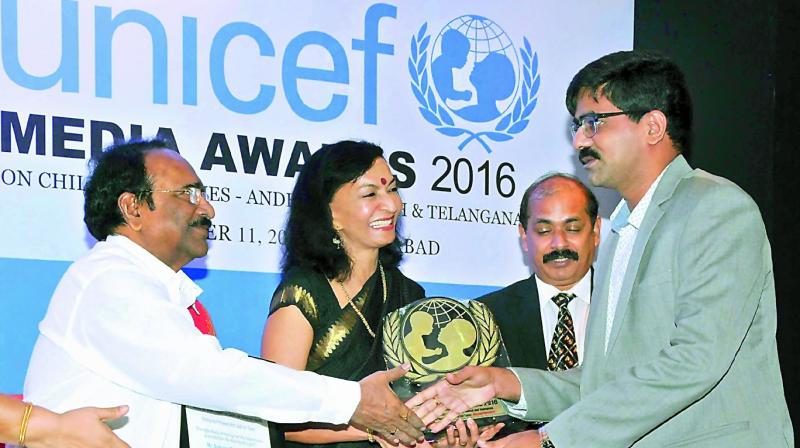 Cine writer Dr Paruchuri Gopala Krishna, former IAS officer and jury chairperson Rachel Chatterji and Unicef TS incharge Sanykutty George present the Unicef media award to DCs U. Sudhakar Reddy for his reports on a teenager ending her life as her house did not have a toilet.  (Photo: DECCAN CHRONICLE)