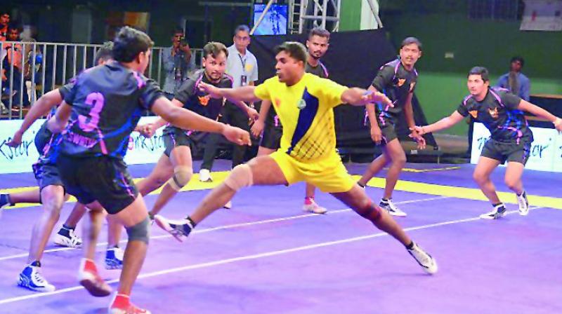 A Siddipet Stalions raider in action against the Warangal Warriors in the Telangana Premier Kabaddi League being played at the Jawaharlal Nehru Indoor Stadium at Hanmakonda in Warangal. The Stalions won 32-20.