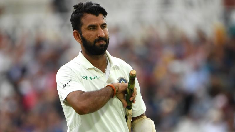 India built a 166-run lead over Australia on the third day of an absorbing opening Test in Adelaide on Saturday with dangerman Cheteshwar Pujara not out 40, although the late wicket of master batsman Virat Kohli gave the home team a glimmer of hope. (Photo: AFP)