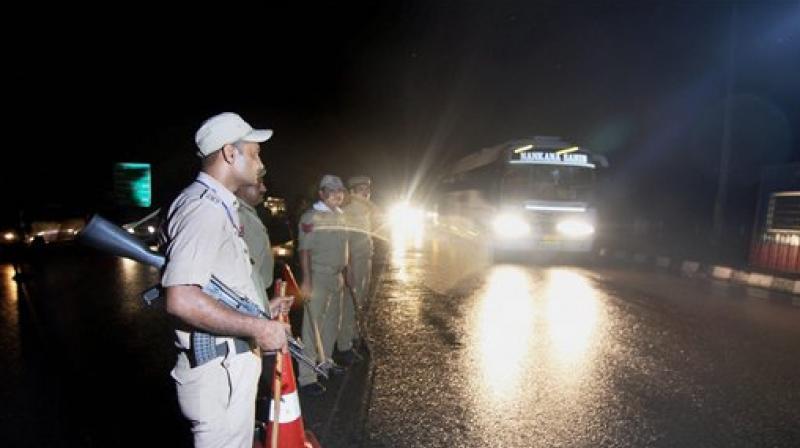 Security personnel keeping a vigil as pilgrims head towards Kashmir to pay obeisance at the Amarnath cave shrine, days after militant attack on pilgrims in Anantnag, in Jammu on Wednesday. (Photo: PTI)