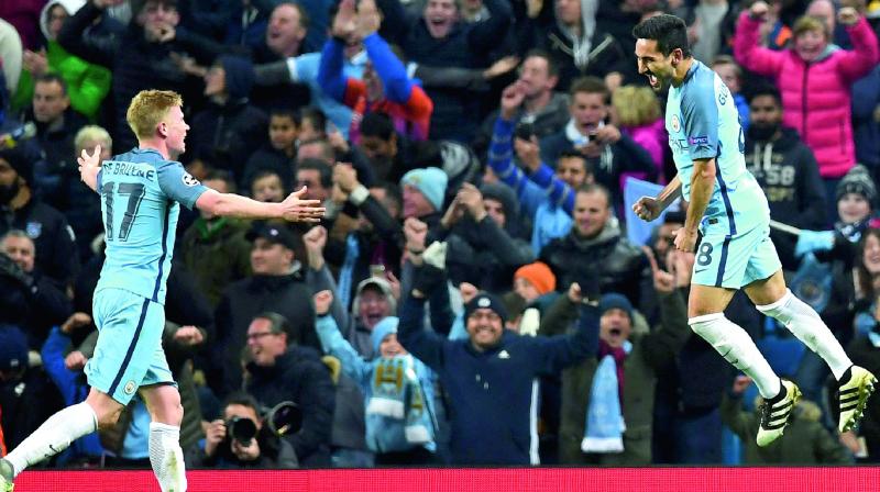 Manchester Citys Ilkay Gundogan (right) celebrates his goal with team mate Kevin de Bruyne in their Champions League Group C match against Barcelona at the Etihad Stadium on Tuesday. The hosts won 3-1. (Photo: AFP)