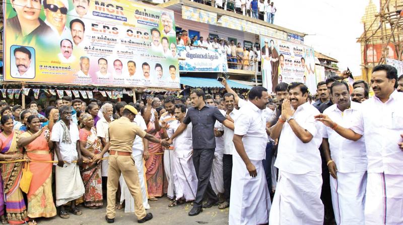 People welcome Chief Minister Edappadi K.Palaniswami on his arrival at Karur to take part in MGR cenetenary celebrations on Wednesday. Transport minister M.R. Vijayabaskar also seen among others. (Photo:  DC)