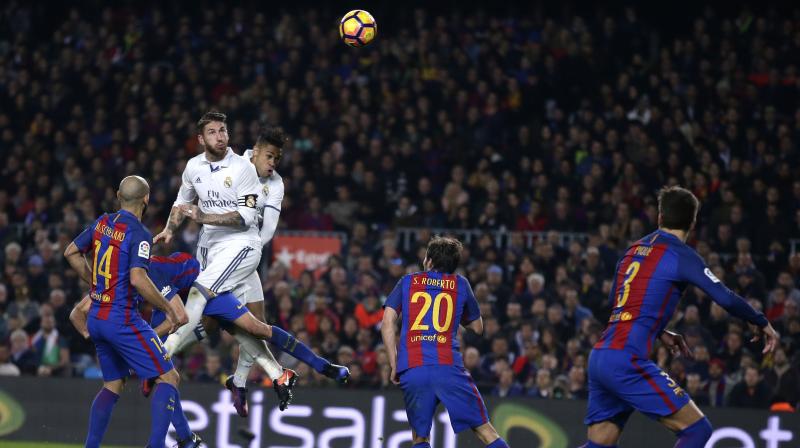 Sergio Ramoss stoppage-time equaliser maintained Real Madrids six-point lead at the top of La Liga. (Photo: PTI)