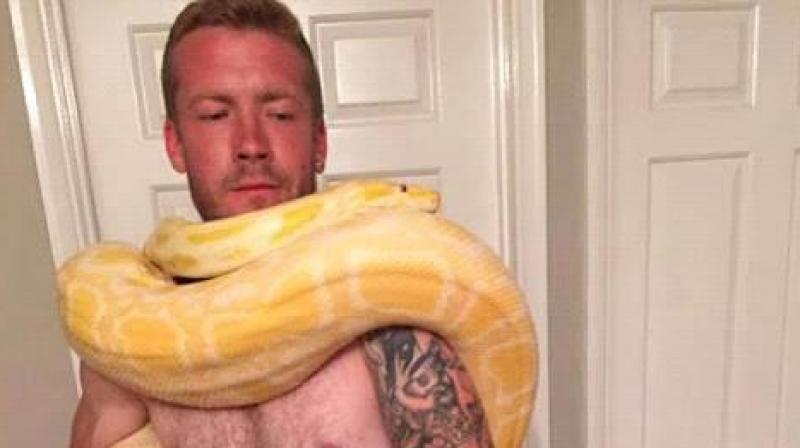 Family members of keen snake handler Dan Brandon said that the snake was  his baby  at an inquest hearing.
