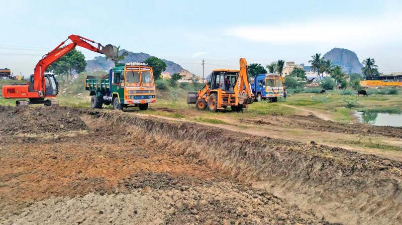 Bulldozers deepen Gingee lake in Villupuram district. (Photo: DC)