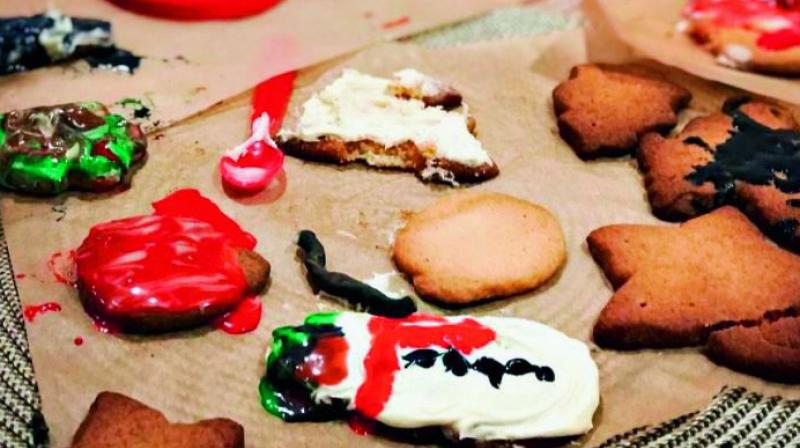 A snowman-shaped cookie, which looked nothing like a snowman, was at the center of the image with white, green and red icing dripping down the sides. (Photo: DC)