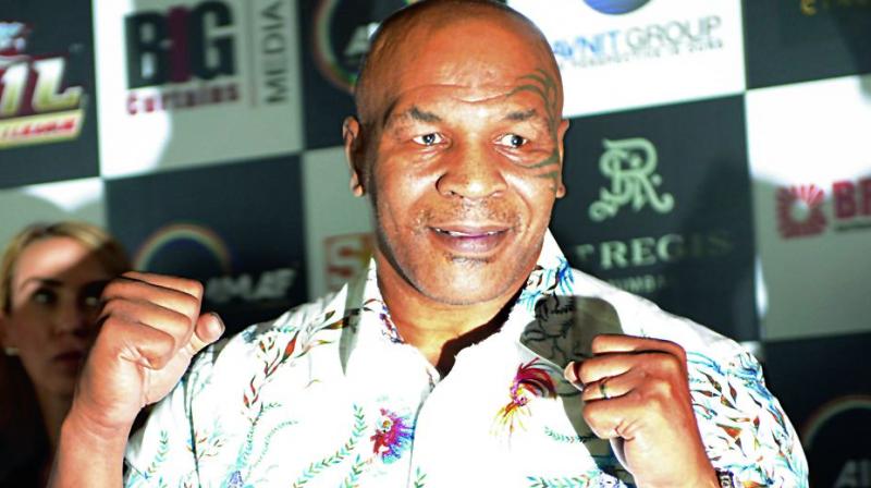 Mike Tyson poses at a promotional event in Mumbai on Friday. (Photo:Rajesh Jadhav)