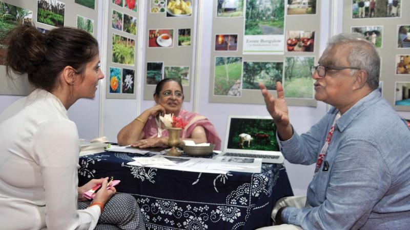 Jose Dominic, former managing director of CGH Earth Group, interacts with a foreign delegate at Kerala Travel Mart in Kochi on Friday. (Photo:DC)