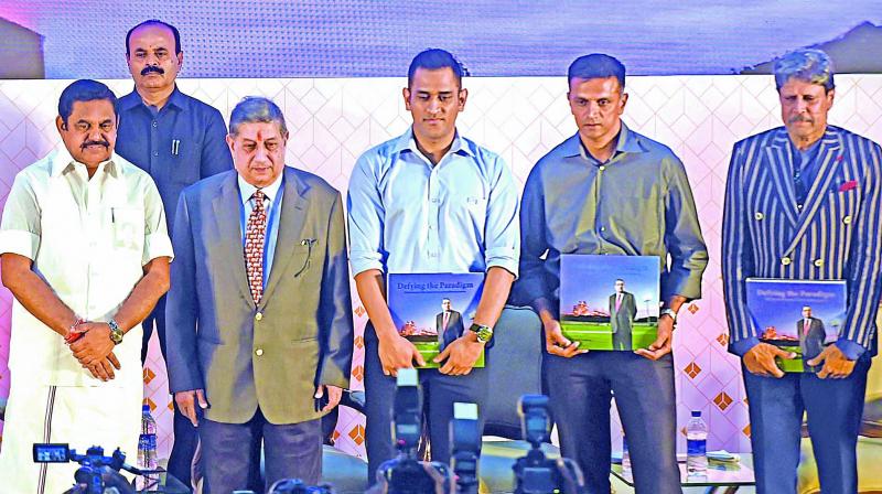 Tamil Nadu chief minister Edappadi K. Palaniswami (left to right), managing director of India Cements N. Srinivasan, M.S. Dhoni, Rahul Dravid and Kapil Dev during the launch of a coffee table book.  (PTI)