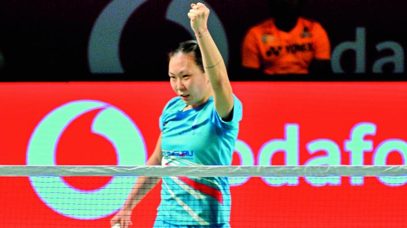 Beiwen Zhang celebrates her win over P. V. Sindhu in Hyderabad on Friday.