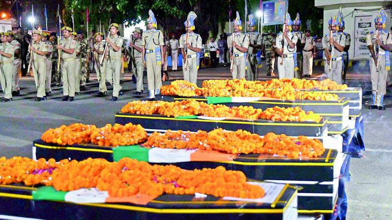 Jawans give gun salute to martyred CRPF personnel at Patna on Tuesday. (Photo: PTI)