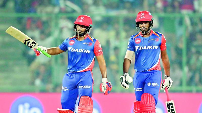 Rishab Pant (left) raises his bat to celebrate his half-century with Sanju Samson looks on during their match against Gujarat Lions in New Delhi on Thursday. (Right) Suresh Raina continued his good run with the bat scoring a whirlwhind 77 to help his team to a formidable total. (Photo:  BCCI)