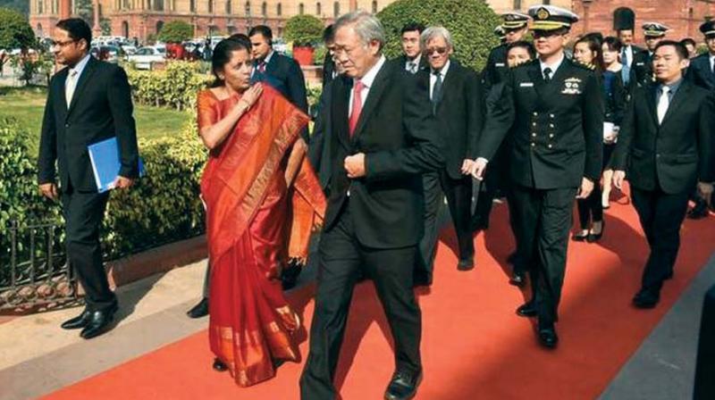 Defence Minister Nirmala Sitharaman receiving Defence Minister of Singapore Ng Eng Hen during his Guard of Honour at South Block, in New Delhi