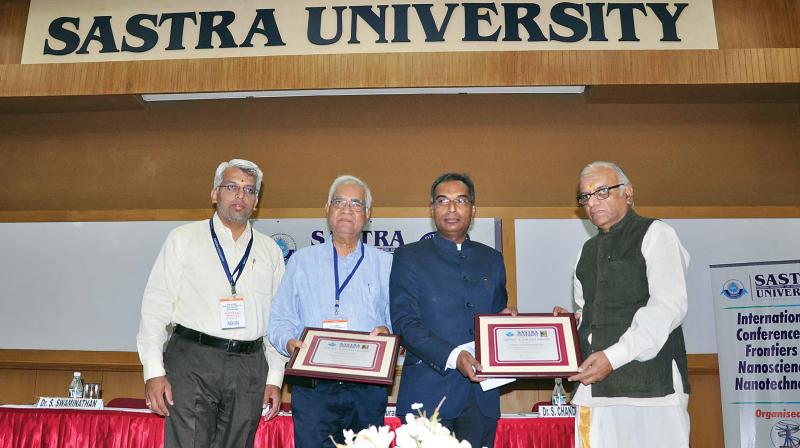 R.Sethuraman, Vice-chancellor, Sastra University presenting the Sastra-CNR Rao award to Prof.S.Chandrasekar, director, Indian Institute of Chemical Technology, Hyderabad and Prof.Baldev Raj, Director, National Institute of Advanced Sciences, Bangalore at Thanjavur on Tuesday.