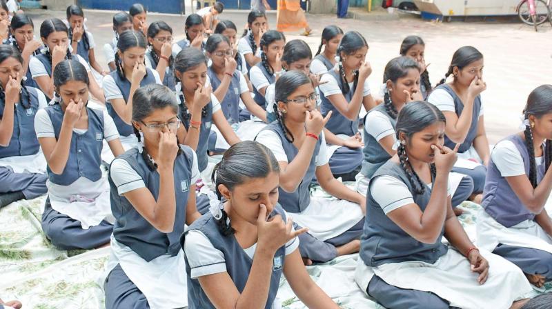 Students of Everwin School in Kolathur meditate in a programme held for class 12 students ahead of their public exams on Tuesday. (Photo: DC)