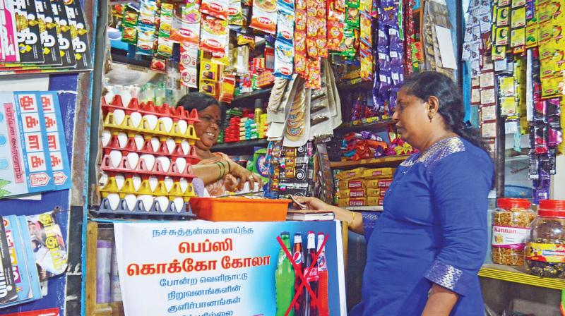 A notice by Tamil Nadu Vanigar Sangam and Tamil Nadu Traders Federation, announcing that colas by popular  foreign brands will not be sold, displayed in a petty shop. (Photo: DC)