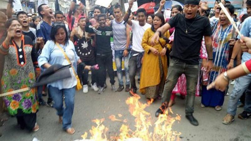 Gorkha Janmukti Morcha (GJM) supporters during their protest in Darjeeling on Thursday. (Photo: PTI)