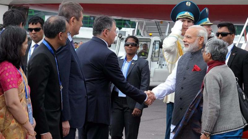 Prime Minister Narendra Modi being received on his arrival in Astana, Kazakhstan on Thursday. (Photo: PTI)